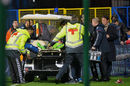 Igor Akinfeev is stretchered off after being hit by a flare
