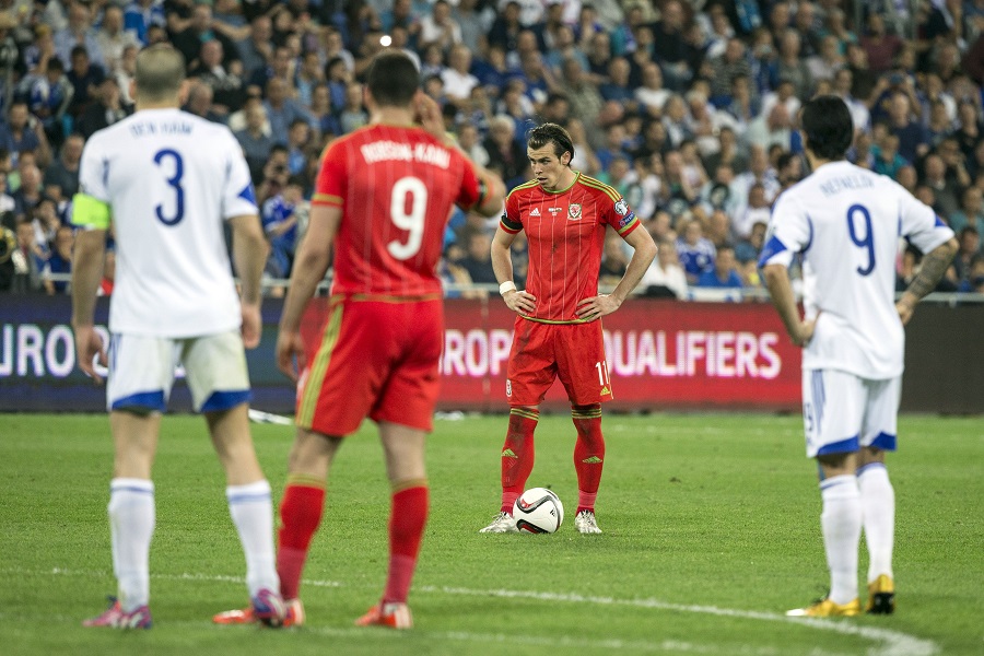 Gareth Bale stands over a free-kick