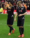 Luis Suarez and Fernando Torres salute the crowd