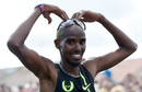 Mo Farah celebrates victory with his signature Mobot