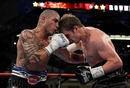 Miguel Cotto throws a right to Yuri Foreman