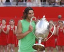 Rafael Nadal checks out his new trophy