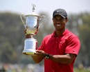 Tiger Woods poses with his trophy