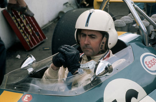 Australian racing driver Jack Brabham behind the wheel