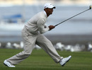 Tiger Woods watches an approach shot