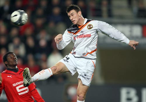 Laurent Koscielny leaps for a header