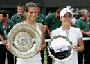 Amelie Mauresmo and Justine Henin hold their plates