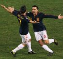 David Villa and Xavi celebrate together
