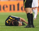 Xabi Alonso lies on the pitch injured
