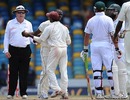 Shivnarine Chanderpaul takes Kemar Roach away from an argument with Jacques Kallis
