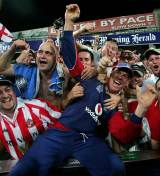 Paul Nixon dives into the Barmy Army as he savours England's victory at Sydney which clinched the CB Series &copy; Getty Images
